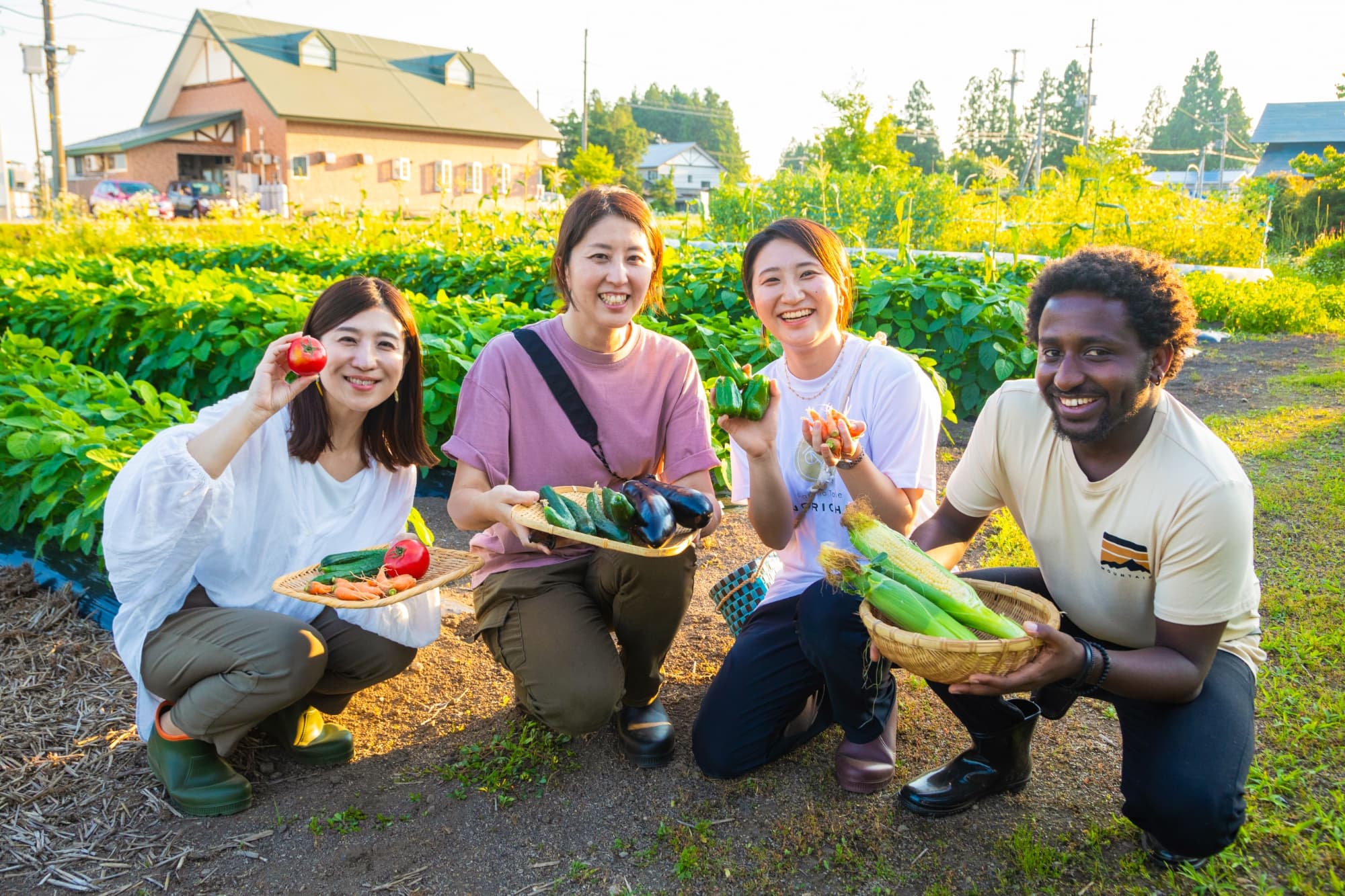 A guest harvesting seasonal vegetables in NORICHIE’s private garden